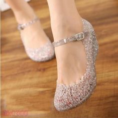 a close up of a person wearing glitter shoes