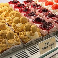 a display case filled with different types of desserts