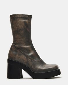 Bring a retro twist to all your looks in KLAYTON. Set on a thick platform sole, these 70s-inspired boots have a close sock-like fit and go with everything from midi skirts to floral dresses. The ultimate throwback! Stretch upper to fit most leg sizes Mid-calf shaft height Looks great with dresses and denim 3.5 inch heel height 1 inch platform 9.75 inch shaft circumference 8 inch shaft height Vegan leather upper material Textile lining Synthetic sock Synthetic sole Imported Mid-calf Platform Boots For Fall, Trendy High Cut Boots For Fall, Fall Chunky Platform High-cut Heeled Boots, Retro Leather Platform Boots For Fall, Fall High Cut Chunky Platform Heeled Boots, Fall High-cut Heeled Boots With Chunky Platform, Fall High-cut Platform Boots With Lug Sole, Fall High-cut Heeled Boots With Lug Sole, High Cut Platform Boots For Fall