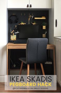 there is a desk and chair in the room with pegboard on the wall behind it