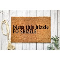 a door mat that says,'bless this hizzle fo shizzle '