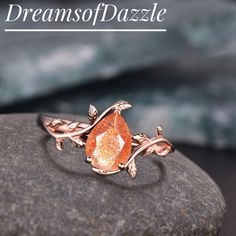 a close up of a ring on a rock with the words dreams of pazzle written above it