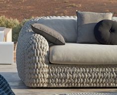 a couch sitting on top of a wooden table