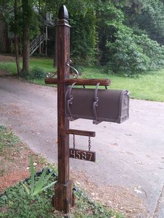 a mailbox attached to a wooden post