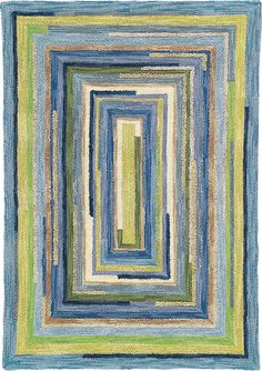 an area rug with multicolored squares and stripes on the bottom in blue, green,