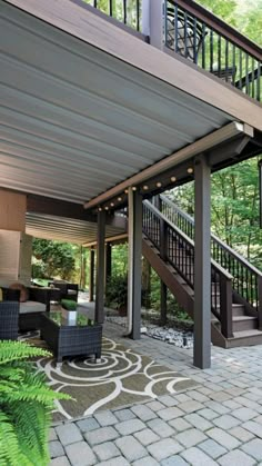 an outdoor living area with patio furniture and stairs