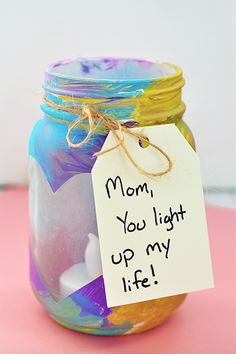 a jar with a note attached to it sitting on a table