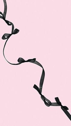 a black ribbon on a pink background