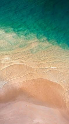 an aerial view of the beach and ocean