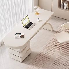 a laptop computer sitting on top of a white desk next to a chair and window