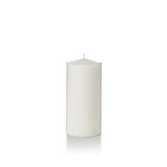 a white pillar candle on a white background