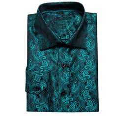 Introducing the Midnight Black and Lake Blue Paisley Silk Dress Shirt, a luxurious addition to your wardrobe. Crafted from the finest silk, this dress shirt offers an exceptionally smooth and comfortable feel. The deep midnight black fabric is beautifully complemented by an intricate lake blue paisley pattern, creating a striking and sophisticated design that exudes elegance. Ideal for formal events and upscale gatherings, this shirt effortlessly combines classic charm with contemporary flair. T Luxury Satin Formal Shirt, Elegant Black Dress Shirt For Semi-formal Occasions, Elegant Blue Fitted Dress Shirt, Elegant Fitted Blue Dress Shirt, Elegant Blue Shirt For Formal Occasions, Elegant Blue Formal Shirt, Elegant Blue Semi-formal Dress Shirt, Elegant Blue Dress Shirt For Formal Occasions, Formal Elegant Blue Dress Shirt