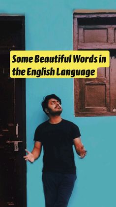 a man standing in front of a blue wall with the words some beautiful words in the english language