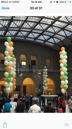 an event with balloons and people in the background