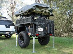 an off road vehicle parked in the grass