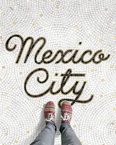 someone's feet in red shoes standing on a mosaic tile floor with the words mexico city