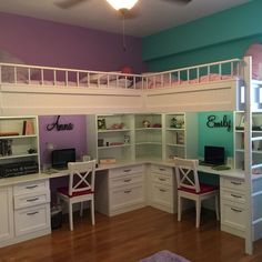 a white loft bed with desk underneath it