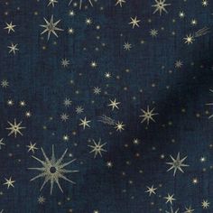 a blue background with white stars and sparkles in the dark, on top of it