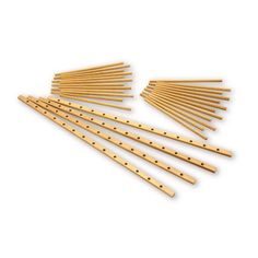 wooden dowels are lined up on a white background