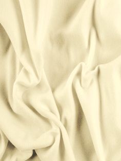 an image of a white cloth textured with light beige fabric material that is very soft