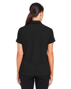 a woman wearing a black shirt and pants with her back turned to the camera, she is