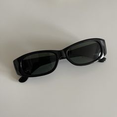 These slim rectangle sunglasses are your everyday classic. Featuring a black frame with black smoke lens. This style is unisex. True genuine vintage sunglasses from the 90s.  - 400 uv  - new vintage from the 90s Measurements:  Frame width: 139mm Lens Height: 30mm  Lens Width: 49mm  Bridge: 19mm  Arm temple: 140mm - includes sunglasses pouch  Also available in tortoise Cool Black Sunglasses, Pointy Sunglasses, Black Rectangle Sunglasses, Dapper Day Outfits, Sunglasses Pouch, Outfit Inspo Summer, Classic Sunglasses, Black Rectangle, Summer Sunglasses