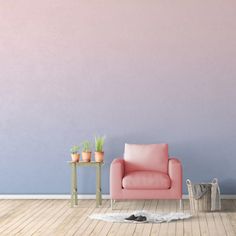 a pink chair sitting in front of a blue wall with potted plants on it