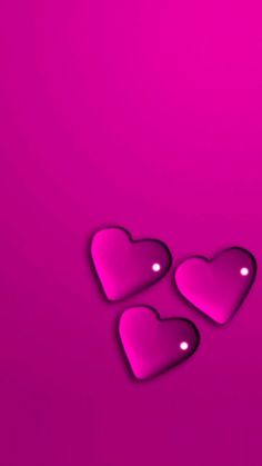 three pink hearts on a purple background