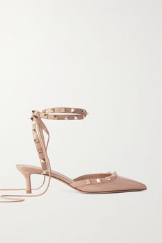 Valentino Garavani's pumps are the latest iteration to join the house's iconic 'Rockstud' family. Made from glossy patent-leather, they're traced with gilded pyramid studs - each one hand applied and galvanized for shine - and have slim straps that lace up the leg. The 50mm heels mean you can wear them comfortably for hours on end. Valentino Rockstud Heels, Rockstud Heels, Valentino Heels, Valentino Garavani Shoes, Valentino Rockstud, Antique Roses, Shoes Heels Pumps, Patent Leather Pumps, Leather Pumps