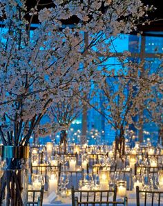 the tables are set with candles and centerpieces for an elegant wedding reception in new york city