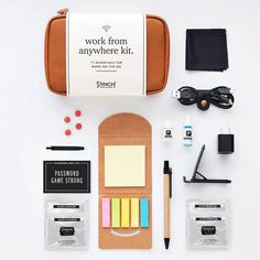 the contents of a work from anywhere kit laid out on a white surface