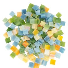 a pile of multicolored glass tiles sitting on top of each other