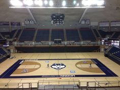 an empty basketball court in the middle of a stadium