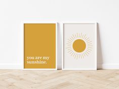 two framed art prints with the words you are my sunshine in white and yellow on them