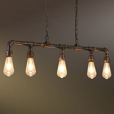 five light bulbs hanging from an industrial style chandelier with exposed pipe and chain