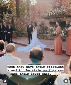 the bride and groom are standing at the alter