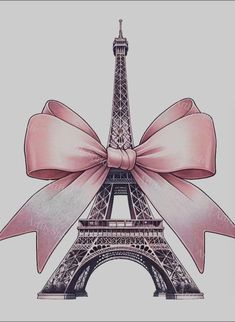 the eiffel tower has a pink bow on it