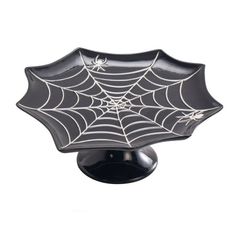 a black and white spider web dish