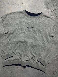 Vintage Crewneck Nike boxy center swoosh y2k fits logo USA 🇺🇸 Size Men's / US XL / EU 56 / 4 Color Grey Condition Gently Used Nike Vintage central logo central swoosh crewneck 80s 90s 00s retro spellout y2k sweatshirt centre swoosh big logo. The material is pleasant to the body. In a good condition. Fast sending! Condition : 8,8/10 Chest - 65 cm Length - 66 cm Shoulders - 59 cm Sleeve Length - 63 cm - ALL ITEMS ARE HEAT TREATED AND WASHED BEFORE SHIPPING - FOLLOW MY STORE - SEE MY OTHER ITEMS Mens Vintage Nike Sweatshirt, Sweat Shirts Mens, Vintage Nike Outfits Men, Vintage Crewneck Outfit, Vintage Nike Outfits, Nike Outfits Men, Nike Vintage Sweatshirt, Logo Usa, Crewneck Outfit