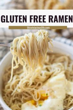 a bowl of gluten free ramen with an egg being lifted from it