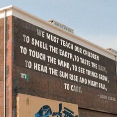 a mural on the side of a building that says we must teach our children to smell the earth