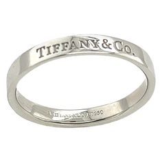 Exuding timeless sophistication, the Tiffany & Co. Platinum Flat Band features a sleek design with the iconic "Tiffany & Co." engraving. Crafted in platinum, it symbolizes elegance and refinement, making it a classic choice for expressing everlasting commitment and style. Width of Band: 3mm Total Weight: 5.43g Ring Size: R1/2 SNS0039 Tiffany And Co Rings, Tiffany And Co Bracelet, Tiffany Rings, Clothes Wishlist, Tiffany And Co, Tiffany & Co., Sleek Design, Band Rings, Platinum