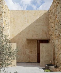 a stone building with an open door in front of it