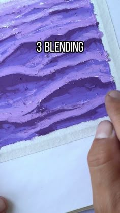 someone is painting an image with purple paint on paper and the words 3 blending are in front of them