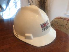 Vintage c. 1986 Plastic Construction Worker's Safety Helmet. It has some light yellow wear lines on the hat as shown. 80s Construction Worker, Construction Worker Costume, Safety Helmet Construction, Vintage Yellow Adjustable Hat, Worker Safety, Safety Helmet, Construction Worker, Costume Hats, Light Yellow