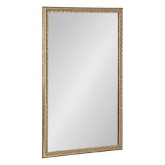 a large gold framed mirror on a white wall with an ornate border around the edge