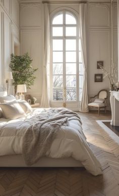 a bed sitting in a bedroom next to a window with lots of light on it