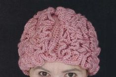 a woman wearing a pink knitted hat