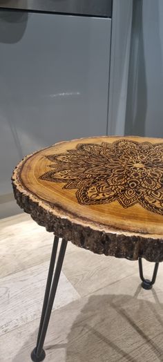 a wooden table sitting on top of a tile floor