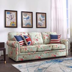 a living room scene with focus on the couch and rug, which has an american flag pillow